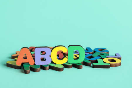 Colorful letters on blue background. Alphabet conceptの写真素材