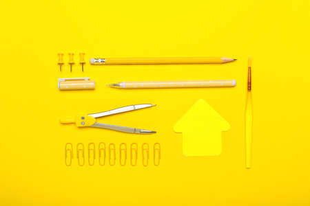Paper clips with school stationery on yellow backgroundの写真素材