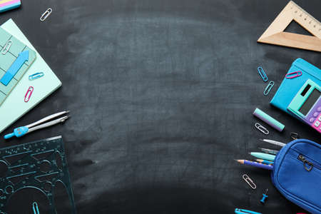 Frame made of stationery supplies on school blackboard