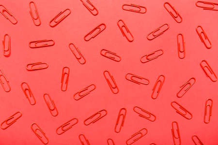 paper clips on red backgroundの写真素材