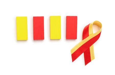 Awareness ribbon with yellow and red blocks on white background. Hepatitis concept