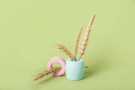 Showcase pedestals and wheat ears on green background