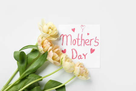 Card with text MOTHER'S DAY and yellow flowers on white background