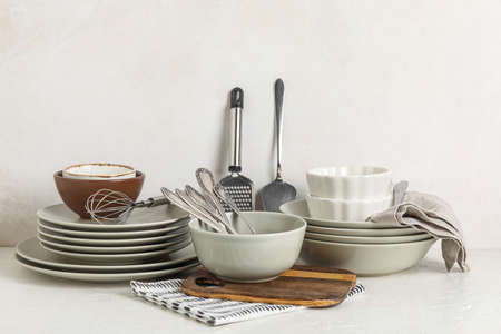 Set of clean dinnerware on light backgroundの写真素材
