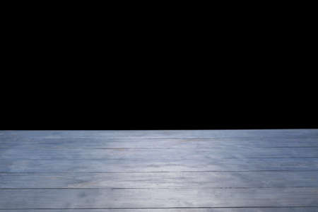 Blue wooden table top on black backgroundの写真素材