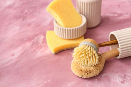 Different cleaning supplies on color backgroundの写真素材