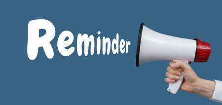 Female hand with megaphone and word REMINDER on blue background