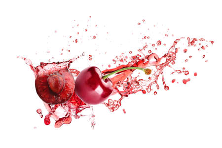 Sweet cherry and splash of juice isolated on whiteの写真素材