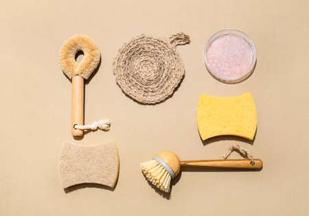 Set of cleaning supplies and detergent on color background