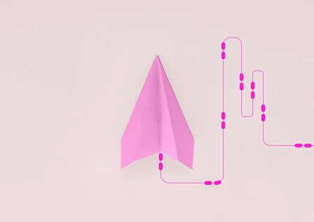 paper plane on pink background