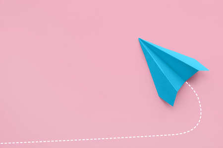 paper plane on pink backgroundの写真素材