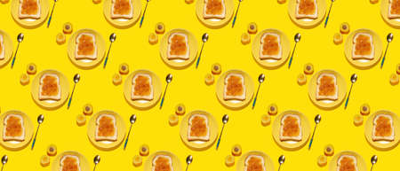 Many plates with tasty toasts and apricot jam on yellow backgroundの写真素材