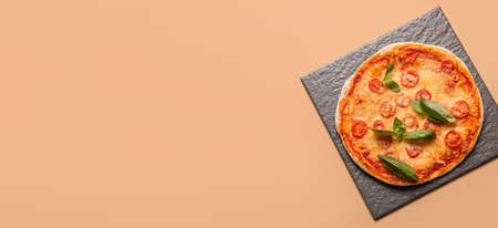 Delicious pizza Margarita on beige background with space for text, top viewの写真素材