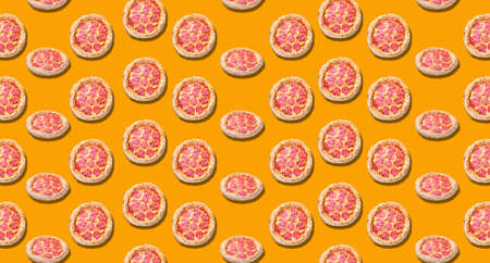 Many tasty pizzas on orange background. pattern for design