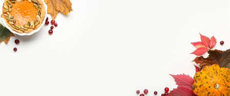Autumn composition with pumpkin and pie on white background with space for textの写真素材