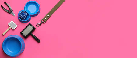Different pet accessories on pink background with space for text, top viewの写真素材