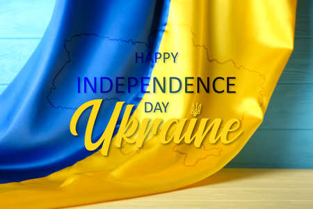 Poster for Ukrainian Independence Day with flag on wooden backgroundの写真素材