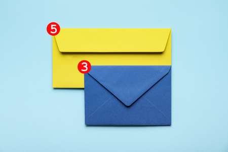Paper envelopes with new unread messages on blue backgroundの写真素材