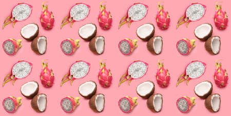 Many tasty dragon fruits and coconuts on pink background. pattern for designの写真素材
