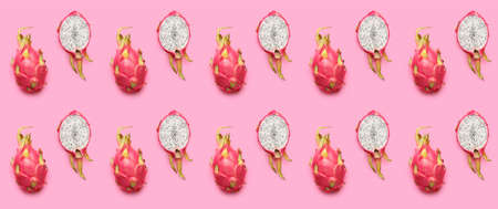 Many tasty dragon fruits on pink background. pattern for designの写真素材
