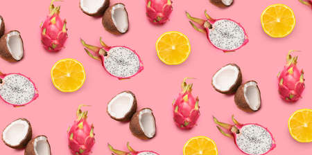 Many tasty tropical fruits on pink background. pattern for design