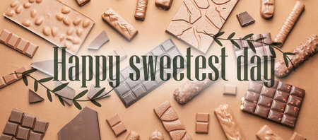 Different chocolate bars on beige background. Happy Sweetest Dayの写真素材