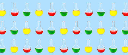 Many laboratory flasks on light blue background. pattern for designの写真素材