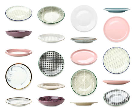 Set of many ceramic plates isolated on whiteの写真素材