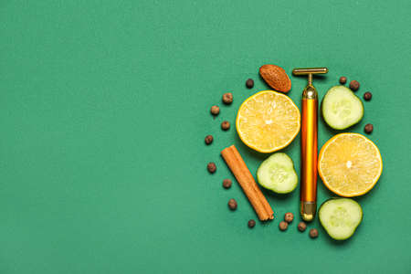 Facial massage tool with natural components on green backgroundの写真素材