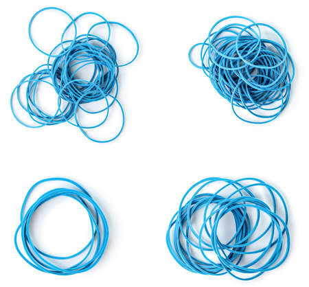Collection of blue elastic bands on white background, top view