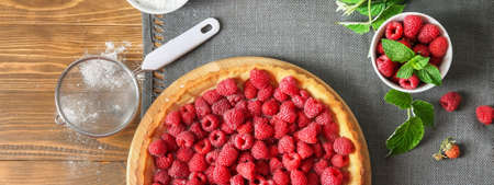 Tasty raspberry pie on wooden table, top viewの写真素材