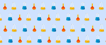 Many laboratory flasks on light blue background. pattern for designの写真素材