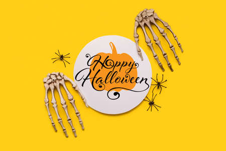 Halloween greeting card and decor on yellow backgroundの写真素材