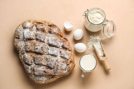 Fresh bread and ingredients for baking on color backgroundの写真素材