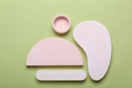 Abstract composition with different showcase pedestals on green backgroundの写真素材