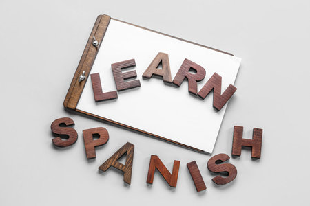 Clipboard with text LEARN SPANISH on gray backgroundの写真素材