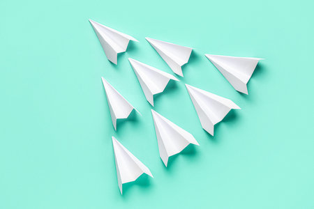 White paper planes on color backgroundの写真素材