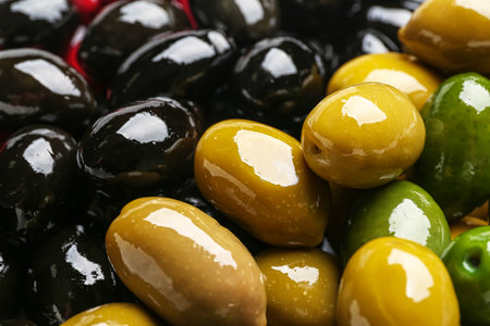 Tasty black and green olives as backgroundの写真素材