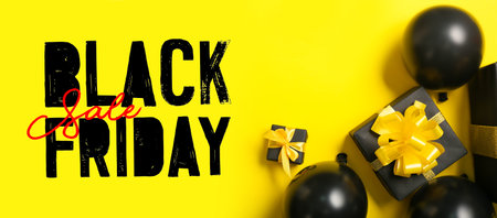 Balloons and gifts on yellow background. black friday saleの写真素材