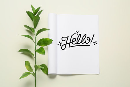 Notebook with word HELLO and branch on light backgroundの写真素材
