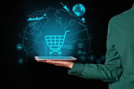 Young woman with tablet computer on dark background. online shopping conceptの写真素材