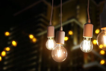 Glowing light bulbs on dark backgroundの写真素材