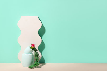 Plaster stands with flower and moss on color backgroundの写真素材