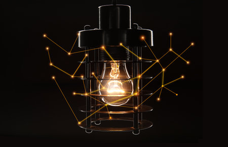 Glowing lamp on black background