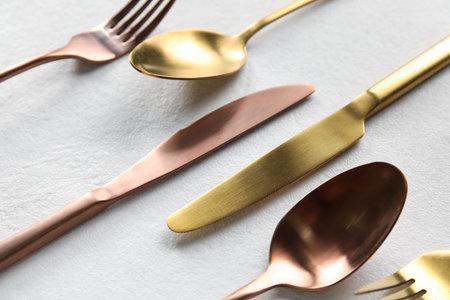 Forks, knives and spoons on white background, closeupの写真素材