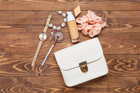 Female accessories and cosmetics on wooden backgroundの写真素材