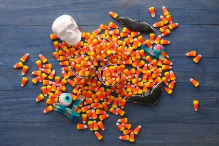 Halloween candies and cookies on dark wooden backgroundの写真素材