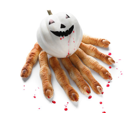 Halloween cookies with spilled jam and pumpkin on white backgroundの写真素材