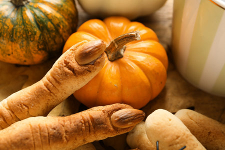 Witch finger cookies with pumpkins on wooden background, closeupの写真素材