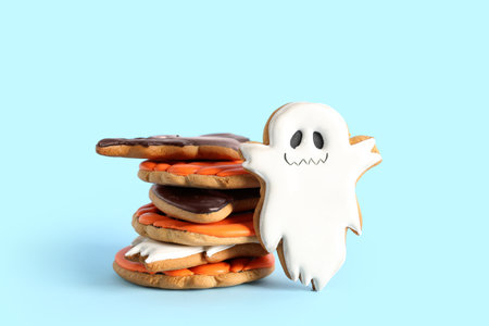 Tasty Halloween cookies on blue backgroundの写真素材
